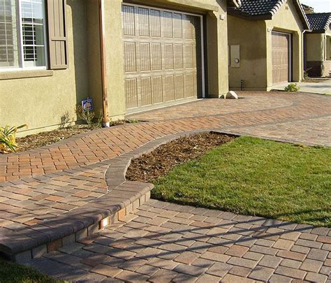 When designing a new pathway, your walkway ideas should flow with your home's overall design scheme. Front Walkway Ideas - Ground Cover Between Pavers