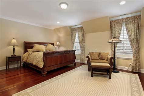 Master Bedroom With Cherry Wood Flooring Stock Photo