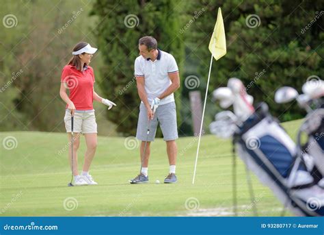Man Teaching Woman How To Play Golf Stock Image Image Of Instruct