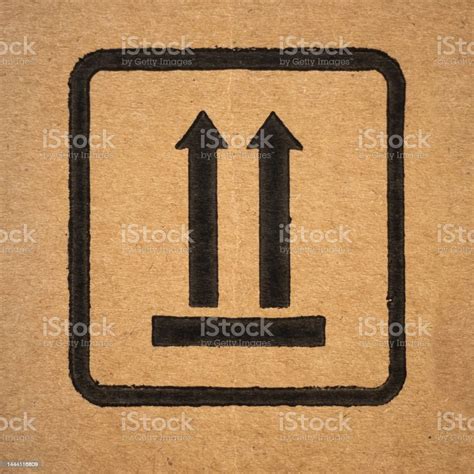 Top Symbol On The Item Packaging On Cardboard Closeup Stock Photo