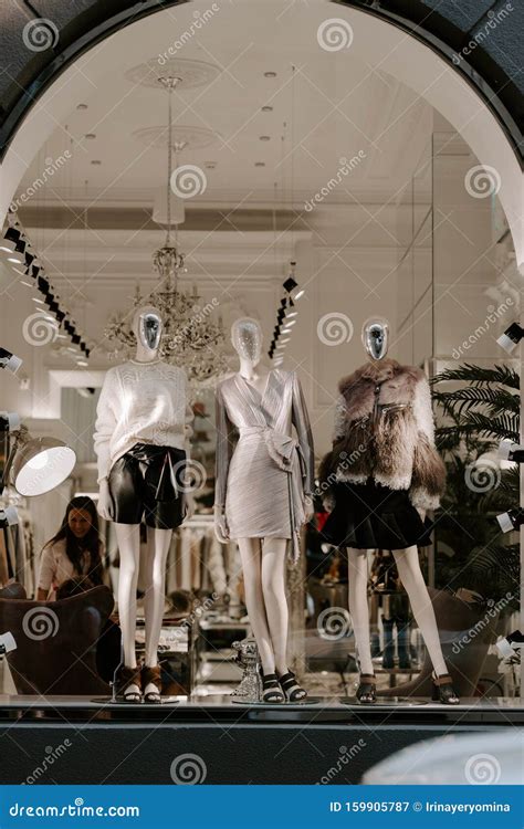 Elite Boutique Display Window With Mannequins In Fashionable Dresses