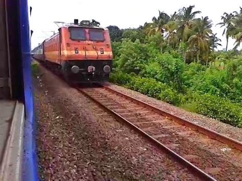 The train runs on the konkan railway. Late running Netravati Express near Kalamassery - YouTube