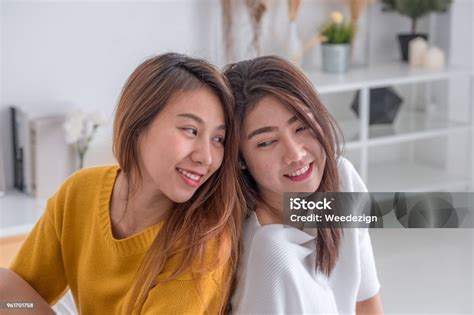 Asia Lesbian Lgbt Couple Hug And Sitting On Bed Near White Window Sunlight With Happiness Moment