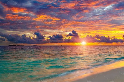 Vibrant Sunset Over Ocean On Stock Photo Containing Sunset And Sky