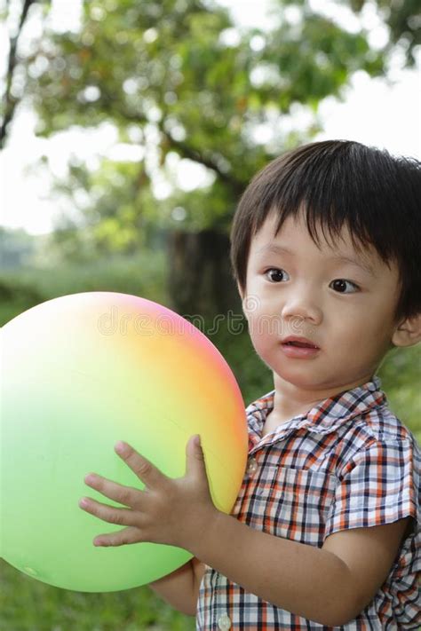 Cute Asian Boy Holding A Ball Stock Image Image Of Asian Malaysian