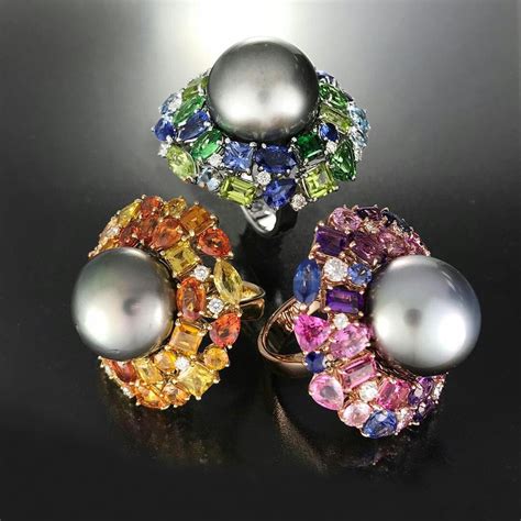 Spinning Three Divine Tahitian Pearls Surrounded By A Myriad Of