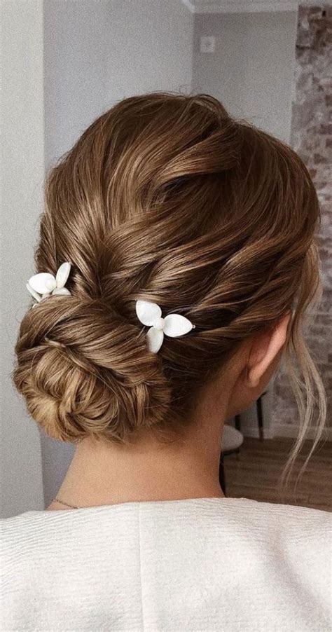 75 trendiest updo hairstyles 2021 timeless twisted low bun