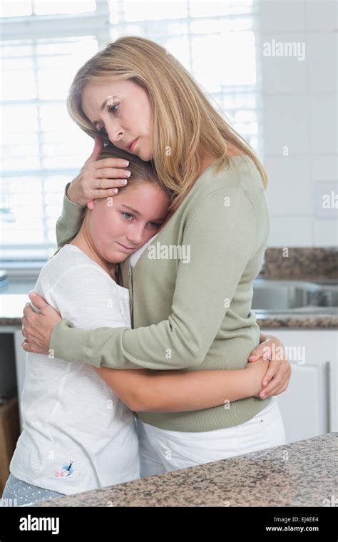 Sad Little Girl Hugging Her Mother Photo Stock Alamy