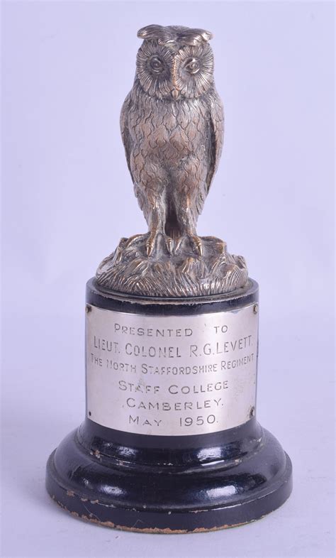 A Late Victorianedwardian Silver Plated Owl Trophy Presented To Lieut