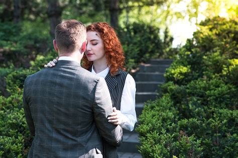 Premium Photo Redhead Couple Wife Hugs Husband With Closed Eyes In