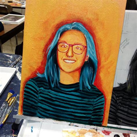 A Painting Of A Woman With Blue Hair And Glasses In Front Of An Easel