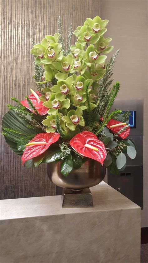 Display Arrangement Of Green Cymbidium Orchids And Red Anthurium Large Flower Arrangements