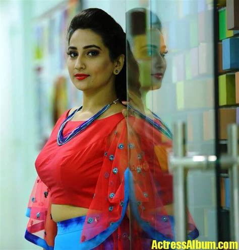 telugu tv anchor manjusha photoshoot in blue lehenga red choli actress album