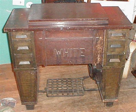 Fiberboard construction places any sewing cabinet in the 1960s at the earliest, while chrome and plywood were common in the 1950s. joels white family rotary