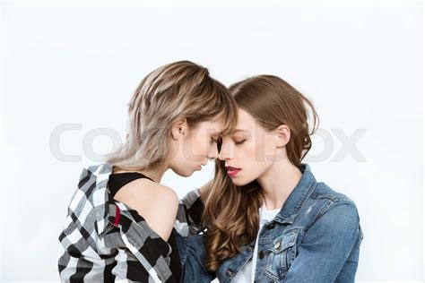 Young Sensual Lesbian Couple Able To Kiss Isolated On Grey Stock