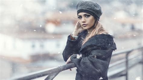 hairstyle windy looking at viewer long hair women fur coats hat hair winter adult snow