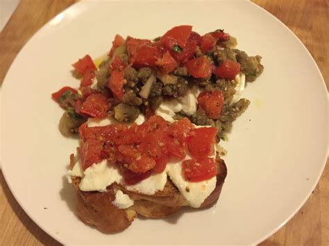 organic grilled eggplant and roasted red peppers tapenade over burrata w ricotta tomatoe