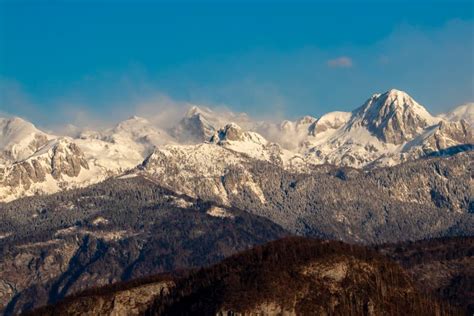 Julian Alps Covered In Morning Mist View From Bohinj Slovenia Stock