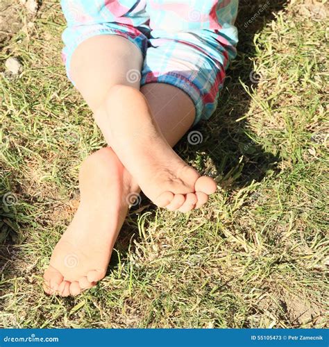 Bare feet of a little girl stock image. Image of child - 55105473