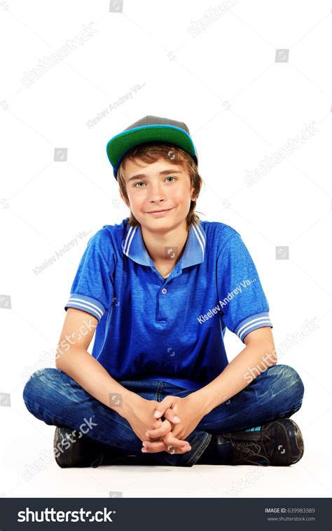 Portrait Positive Teenage Boy Sitting On Stock Photo 639983389