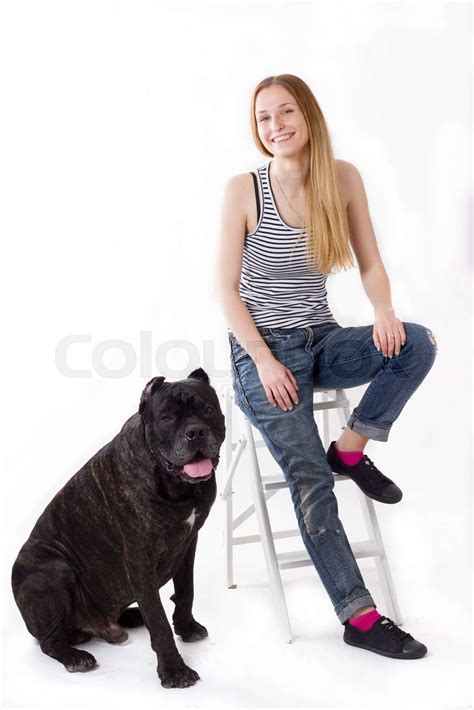 Girl Is Sitting On A Stepladder Her Dog Cane Corso Next Stock Image