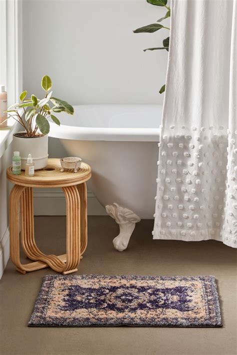 For extra slip protection, rubber mats can be purchased for specific use inside a bathtub or shower. Marcella Printed Bath Mat | Bathroom rugs, Urban ...