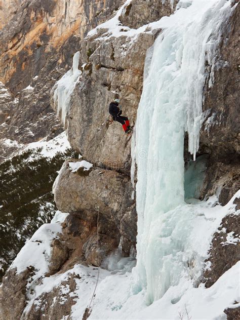 Ice Climber Rappelling Down Frozen Waterfall Editorial Photo Image Of