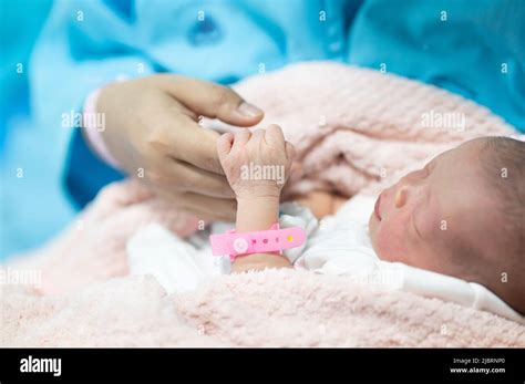 Mother Hand Holding Their New Born Baby Finger Hand Closeup Newborn