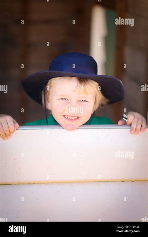 Blonde Preschool Boy Smiling And Posing For Kindy Portraits Stock Photo