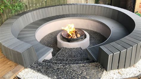 In this video i show and explain how i built my fire pit from retaining wall blocks with a galvanised round garden bed for the inner rim. Circular seating and fire pit construction with block ...