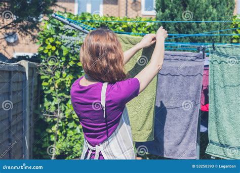 Woman Hanging Her Laundry In Garden Stock Image Image Of Apron Cord