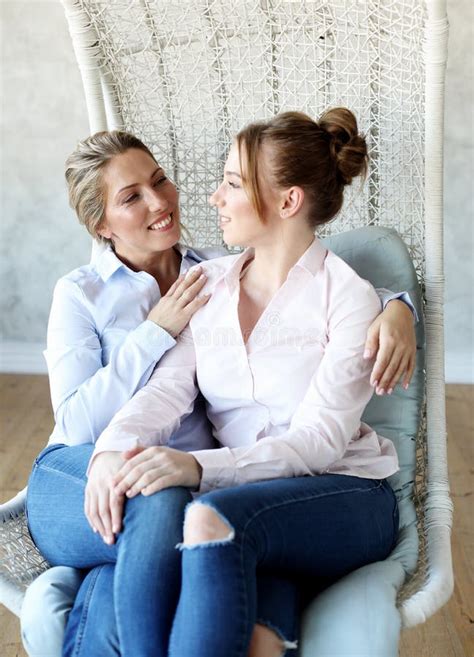 Mature Motherand Daughter Hugging Each Other In Armchair Stock Image Image Of Activity