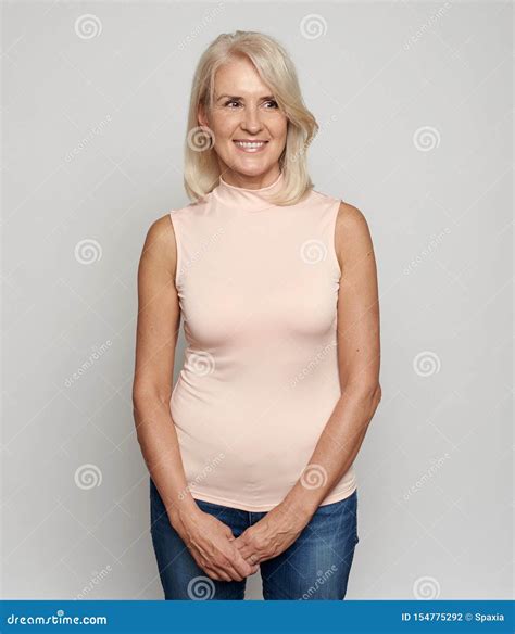 Beautiful Years Old Woman Is Smiling Isolated On Grey Stock Photo