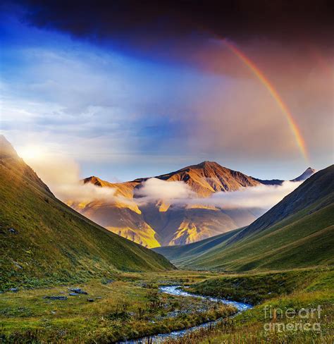 Rainbow Over River And Mountains At Sunset Photograph By Stephan Grixti