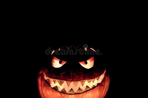 Candlelight Halloween Pumpkin Smile With Burning Fire Eyes Mouth Stock