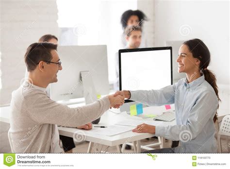 Smiling Female Worker Congratulating Job Applicant With Successf Stock