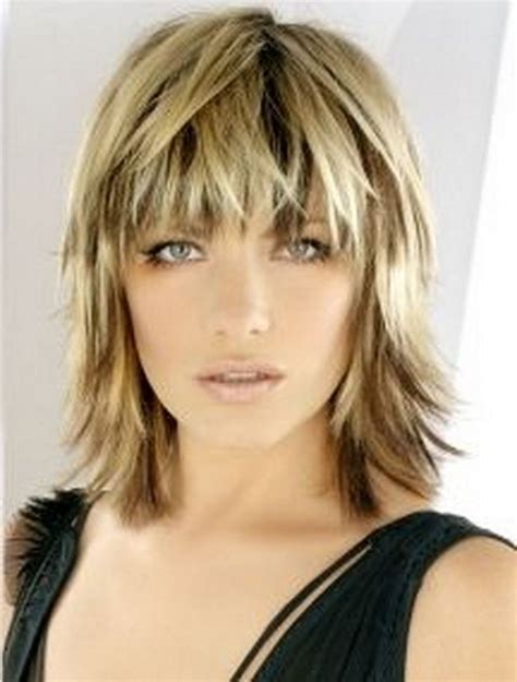 Blonde Medium Length Choppy Shag Haircut With Wispy Bangs