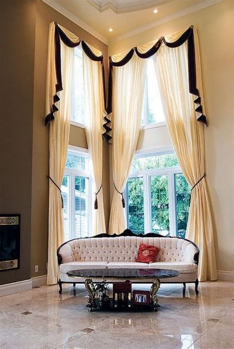 A Living Room Filled With Furniture Next To A Window Covered In Drapes