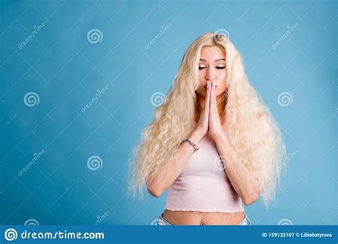 Beautiful Blonde Woman Closes Her Eyes And Pleading For The Best On Blue Stock Image Image Of