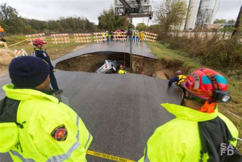 Massive Sinkhole Swallows Two Cars In Texas 13 Pics