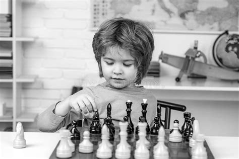 Preschooler Or Schoolboy Thinking Child Chess Strategy Kid Playing