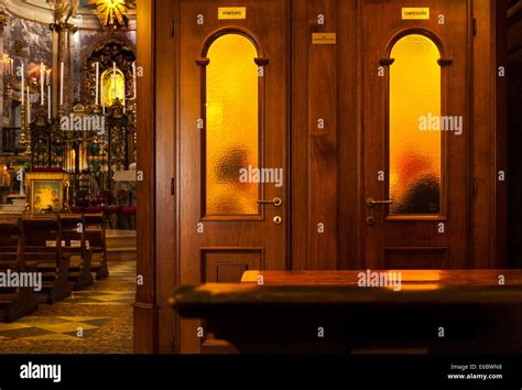 Priest Hearing Confession In Confessional Box Booth In Roman Catholic