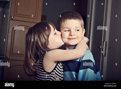 Adorable Little Girl Kissing A Boy Stock Photo Alamy