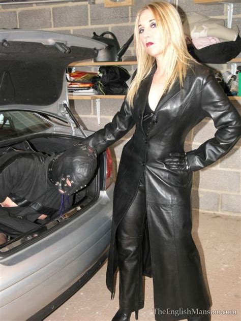 mistresses in long leather coats ready to treat their slaves long leather coat black