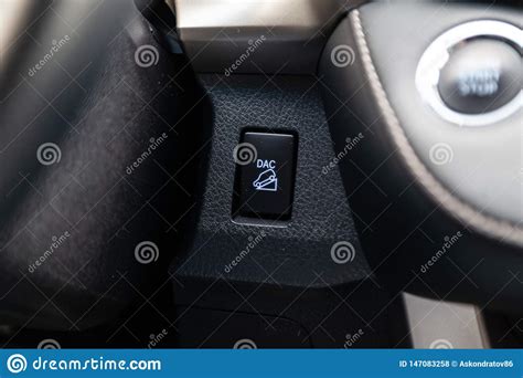 The Center Console Of The Car With Control Buttons For Down Hill