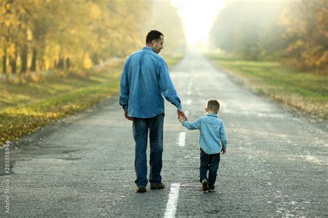 Father And Son Walk In Nature Stock Photo Adobe Stock