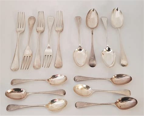 A Large Collection Of Silver Flatware To Include Four Silver Rat Tail Pattern Table Spoons