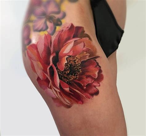 A Womans Thigh With Flowers Painted On It