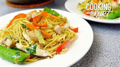 pancit canton filipino stir fried flour stick noodles with pork and vegetables cooking with