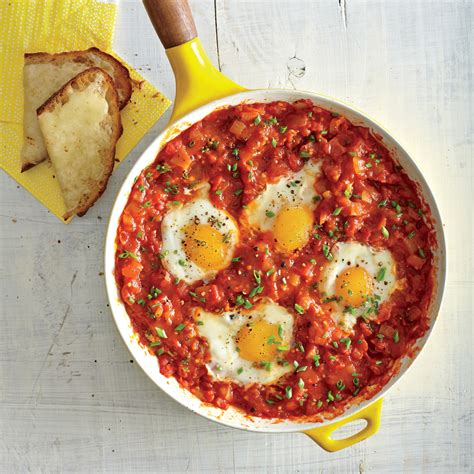 Eggs Poached In Tomato Sauce And Garlic Cheese Toasts Recipe Myrecipes